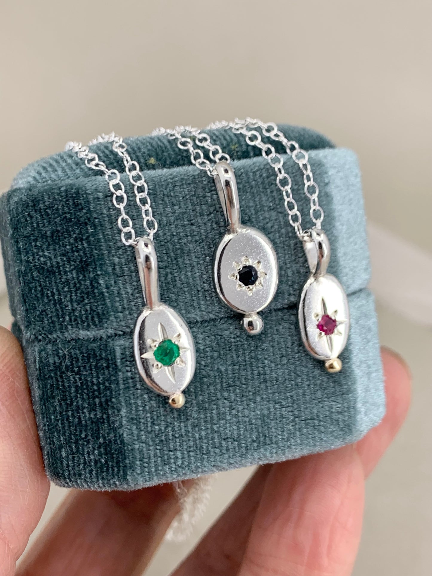 Star set pendant with emerald, sapphire or ruby